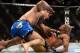 Dec 28, 2013; Las Vegas, NV, USA; Chris Weidman (red gloves) and Anderson Silva (blue gloves) fight during their UFC middleweight championship bout at the MGM Grand Garden Arena. Weidman won. Mandatory Credit: Jayne Kamin-Oncea-USA TODAY Sports