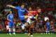 MANCHESTER, ENGLAND - AUGUST 26: Oscar of Chelsea is challenged by Nemanja Vidic of Manchester United during the Barclays Premier League match between Manchester United and Chelsea at Old Trafford on August 26, 2013 in Manchester, England. (Photo by Al
