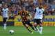 HULL, ENGLAND - AUGUST 24: Jake Livermore of Hull City in action with Bradley Johnson of Norwich City during the Barclays Premier League match between Hull City and Norwich City at the KC Stadium on August 24, 2013 in Hull, England. (Photo by Chris Brunsk
