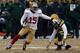GREEN BAY, WI - JANUARY 05: Michael Crabtree #15 of the San Francisco 49ers runs with the ball after a catch against Morgan Burnett #42 of the Green Bay Packers during their NFC Wild Card Playoff game at Lambeau Field on January 5, 2014 in Green Bay, Wis