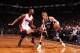 NEW YORK, NY - JANUARY 10: Andrei Kirilenko #47 of the Brooklyn Nets dribbles against Chris Bosh #1 of the Miami Heat during a game at the Barclays Center on January 10, 2014 in the Brooklyn borough of New York City. NOTE TO USER: User expressly acknowle