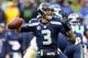 SEATTLE, WA - JANUARY 11: Quarterback Russell Wilson #3 of the Seattle Seahawks looks to pass the ball against the New Orleans Saints in the second quarter during the NFC Divisional Playoff Game at CenturyLink Field on January 11, 2014 in Seattle, Washin