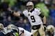 SEATTLE, WA - JANUARY 11: Quarterback Drew Brees #9 of the New Orleans Saints calls out from under center in the first half against the Seattle Seahawks during the NFC Divisional Playoff Game at CenturyLink Field on January 11, 2014 in Seattle, Washingto