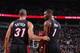 PORTLAND, OR - DECEMBER 28: Shane Battier #31 and Chris Bosh #1 of the Miami Heat talk during a game against the Portland Trailblazers on December 28, 2013 at the Moda Center Arena in Portland, Oregon. NOTE TO USER: User expressly acknowledges and agrees