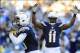 Dec 22, 2013; San Diego, CA, USA; San Diego Chargers receiver Keenan Allen (13) and receiver Eddie Royal (11) celebrate after a touchdown reception during the second half against the Oakland Raiders at Qualcomm Stadium. Mandatory Credit: Christopher Hanew