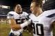 Dec 12, 2013; Denver, CO, USA; San Diego Chargers linebackers Manti Te'o and Thomas Keiser (90) celebrate after the game against the Denver Broncos at Sports Authority Field at Mile High. The Chargers won 27-20. Mandatory Credit: Chris Humphreys-USA TODA