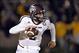 Nov 30, 2013; Columbia, MO, USA; Texas A&M Aggies quarterback Johnny Manziel (2) scrambles to the outside against the Missouri Tigers during the first half at Faurot Field. Mandatory Credit: Peter G. Aiken-USA TODAY Sports