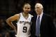 Dec 23, 2013; San Antonio, TX, USA; San Antonio Spurs guard Tony Parker (9) talks with head coach Gregg Popovich during the second half against the Toronto Raptors at AT&T Center. The Spurs won 112-99. Mandatory Credit: Soobum Im-USA TODAY Sports