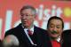 CARDIFF, WALES - NOVEMBER 24: Former Manchester United manager Alex Ferguson (l) and Cardiff owner Vincent Tan look on before the Barclays Premier League match between Cardiff City and Manchester United at Cardiff City Stadium on November 24, 2013 in Car