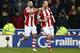 STOKE ON TRENT, ENGLAND - JANUARY 12: Charlie Adam of Stoke City celebrates with Jonathan Walters (L) as he scores their second goal during the Barclays Premier League match between Stoke City and Liverpool at Britannia Stadium on January 12, 2014 in Sto