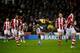 STOKE ON TRENT, ENGLAND - JANUARY 12: Luis Suarez of Liverpool (C) controls the ball during the Barclays Premier League match between Stoke City and Liverpool at Britannia Stadium on January 12, 2014 in Stoke on Trent, England. (Photo by Laurence Griffi