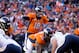 Jan 12, 2014; Denver, CO, USA; Denver Broncos quarterback Peyton Manning (18) calls a play in the second quarter against the San Diego Chargers during the 2013 AFC divisional playoff football game at Sports Authority Field at Mile High. Mandatory Credit:
