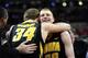 COLUMBUS, OH - JANUARY 12: Adam Woodbury #34 of the Iowa Hawkeyes and Aaron White #30 of the Iowa Hawkeyes embrace after the end of the game against the Ohio State Buckeyes on January 12, 2014 at Value City Arena in Columbus, Ohio. Ohio State lost by a