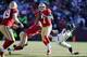 SAN FRANCISCO, CA - DECEMBER 08: Quarterback Colin Kaepernick #7 of the San Francisco 49ers looks for wide receiver Michael Crabtree as he steps out of the way of cornerback Richard Sherman #25 of the Seattle Seahawks in the second quarter on December 8,