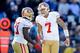 CHARLOTTE, NC - JANUARY 12: Frank Gore #21 and Colin Kaepernick #7 of the San Francisco 49ers react after a play in the second half against the Carolina Panthers during the NFC Divisional Playoff Game at Bank of America Stadium on January 12, 2014 in Char