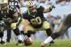 TAMPA, FL - SEPTEMBER 15: Center Brian de la Puente #60 of the New Orleans Saints directs play against the Tampa Bay Buccaneers September 15, 2013 at Raymond James Stadium in Tampa, Florida. The Saints won 16 - 14. (Photo by Al Messerschmidt/Getty Images)