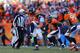 DENVER, CO - JANUARY 12: Malik Jackson #97, Shaun Phillips #90 and Wesley Woodyard #52 of the Denver Broncos celebrate a second quarter sack on Philip Rivers #17 of the San Diego Chargers during the AFC Divisional Playoff Game at Sports Authority Fie