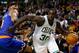 Dec 13, 2013; Boston, MA, USA; Boston Celtics power forward Brandon Bass (30) dribbles the ball around New York Knicks power forward Kenyon Martin (3) during the second half at TD Garden. Mandatory Credit: Mark L. Baer-USA TODAY Sports