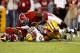 Charles Scott injured his collarbone after being smacked to the ground by two Alabama defenders.