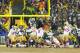 Jan 5, 2014; Green Bay, WI, USA; San Francisco 49ers kicker Phil Dawson (9) kicks the game winning field goal during the fourth quarter against the Green Bay Packers during the 2013 NFC wild card playoff football game at Lambeau Field. San Francisco won