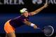 MELBOURNE, AUSTRALIA - JANUARY 13: Ashleigh Barty of Australia plays a forehand in her first round match against Serena Williams of the United States during day one of the 2014 Australian Open at Melbourne Park on January 13, 2014 in Melbourne, Australia