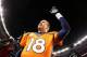 DENVER, CO - JANUARY 12: Peyton Manning #18 of the Denver Broncos celebrates their 24 to 17 win over the San Diego Chargers during the AFC Divisional Playoff Game at Sports Authority Field at Mile High on January 12, 2014 in Denver, Colorado. (Photo by