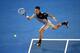 MELBOURNE, AUSTRALIA - JANUARY 13: Novak Djokovic of Serbia plays a forehand in his first round match against Lukas Lacko of Slovakia during day one of the 2014 Australian Open at Melbourne Park on January 13, 2014 in Melbourne, Australia. (Photo by Cli