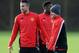MANCHESTER, ENGLAND - DECEMBER 09: Wayne Rooney of Manchester United looks on with team-mate Robin Van Persie during a first team training session, ahead of their UEFA Champions League Group A match against Shakhtar Donetsk, at Aon Training Complex on De