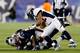 FOXBORO, MA - NOVEMBER 24: Running back LeGarrette Blount #29 of the New England Patriots fumbles the ball after being hit by strong safety Duke Ihenacho #33 and middle linebacker Wesley Woodyard #52 of the Denver Broncos during a game at Gillette Stadiu