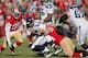 SAN FRANCISCO, CA - DECEMBER 08: Defensive tackle Justin Smith #94 of the San Francisco 49ers sacks quarterback Russell Wilson #3 of the Seattle Seahawks for a loss of five yards in the first quarter on December 8, 2013 at Candlestick Park in San Francis
