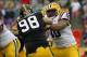Jan 1, 2014; Tampa, Fl, USA; LSU Tigers offensive tackle La'el Collins (70) blocks as Iowa Hawkeyes defensive lineman Mike Hardy (98) rushes during the first half at Raymond James Stadium. Mandatory Credit: Kim Klement-USA TODAY Sports