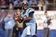 Dec 28, 2013; Charlotte, NC, USA; North Carolina Tar Heels quarterback Marquise Williams (12) passes the ball during the third quarter against the Cincinnati Bearcats in the Belk Bowl at Bank of America Stadium. Carolina defeated Cincinnati 39-17. Mandato