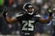 SEATTLE, WA. - DECEMBER 23: Cornerback Richard Sherman #25 of the Seattle Seahawks celebrates a tackle during the fourth quarter of the game against the San Francisco 49ers at CenturyLink Field on December 23, 2012 in Seattle,Wa. The Seahawks won the game