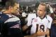 Oct 7, 2012; Foxborough, MA, USA; New England Patriots quarterback Tom Brady (12) shakes hands with Denver Broncos quarterback Peyton Manning (18) following the game at Gillette Stadium. The Patriots defeated the Broncos 31-21. Mandatory Credit: Stew Miln