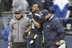 Jan 11, 2014; Seattle, WA, USA; Seattle Seahawks wide receiver Percy Harvin (11) is helped off the field by medical staff members against the New Orleans Saints during the first half of the 2013 NFC divisional playoff football game at CenturyLink Field. M