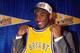INGLEWOOD, CA - JULY 11: Kobe Bryant holds a #8 Los Angeles Lakers jersey after being the 13th overall pick in the 1996 NBA Draft by the Charlotte Hornets who then traded his draft rights to the Los Angels Lakers on July 11, 1996 in Inglewood, California