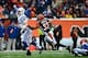 Dec 8, 2013; Cincinnati, OH, USA; Indianapolis Colts quarterback Andrew Luck (12) throws a pass while being pressed by Cincinnati Bengals defensive back Chris Crocker (32) during the second quarter at Paul Brown Stadium. Mandatory Credit: Andrew Weber-USA