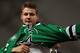 NEWARK, NJ - JUNE 30: Valeri Nichushkin puts on his jersey after being selected tenth overall by the Dallas Stars during the 2013 NHL Draft at Prudential Center on June 30, 2013 in Newark, New Jersey. (Photo by Dave Sandford/NHLI via Getty Images)
