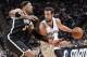 SAN ANTONIO, TX - December 31: Marco Belinelli #3 of the San Antonio Spurs drives to the basket against Mirza Teletovic #33 of the Brooklyn Nets at the AT&T Center on December 31, 2013 in San Antonio, Texas. NOTE TO USER: User expressly acknowledges and a