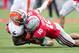 November 3, 2012; Columbus, OH, USA; Ohio State Buckeyes linebacker Ryan Shazier (10) tackles Illinois Fighting Illini running back Donovonn Young (5) after a short gain at Ohio Stadium. Ohio State won the game 52-22. Mandatory Credit: Greg Bartram-USA TO