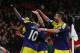 MANCHESTER, ENGLAND - JANUARY 05: Wilfried Bony of Swansea City celebrates with his team-mates after scoring his team's second goal during the FA Cup with Budweiser Third round match between Manchester United and Swansea City at Old Trafford on January 5