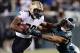 Jan 4, 2014; Philadelphia, PA, USA; New Orleans Saints running back Khiry Robinson (29) stiff arms Philadelphia Eagles inside linebacker Mychal Kendricks (95) during the first half of the 2013 NFC wild card playoff football game at Lincoln Financial Field