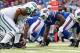 Nov 17, 2013; Orchard Park, NY, USA; New York Jets tackle Austin Howard (77) and Buffalo Bills defensive tackle Marcell Dareus (99) during the first half at Ralph Wilson Stadium. Mandatory Credit: Kevin Hoffman-USA TODAY Sports