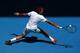 MELBOURNE, AUSTRALIA - JANUARY 14: Roger Federer of Switzerland plays a backhand in his first round match against James Duckworth of Australia during day two of the 2014 Australian Open at Melbourne Park on January 14, 2014 in Melbourne, Australia. (Pho