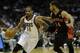 MILWAUKEE, WI - NOVEMBER 2: Gary Neal #12 of the Milwaukee Bucks dribbles the basketball with D.J. Augustin #14 of the Toronto Raptors defending in the second half of play at Bradley Center on November 2, 2013 in Milwaukee, Wisconsin. NOTE TO USER: User e