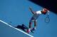 MELBOURNE, AUSTRALIA - JANUARY 14: Roger Federer of Switzerland serves in his first round match against James Duckworth of Australia during day two of the 2014 Australian Open at Melbourne Park on January 14, 2014 in Melbourne, Australia. (Photo by Cliv