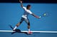 MELBOURNE, AUSTRALIA - JANUARY 14: Roger Federer of Switzerland plays a backhand in his first round match against James Duckworth of Australia during day two of the 2014 Australian Open at Melbourne Park on January 14, 2014 in Melbourne, Australia. (Pho
