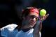 MELBOURNE, AUSTRALIA - JANUARY 14: Roger Federer of Switzerland serves in his first round match against James Duckworth of Australia during day two of the 2014 Australian Open at Melbourne Park on January 14, 2014 in Melbourne, Australia. (Photo by Cliv