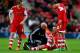SOUTHAMPTON, ENGLAND - JANUARY 04: Rickie Lambert of Southampton (2R) is given treatment during the FA Cup with Budweiser Third round match between Southampton and Burnley at St Mary's Stadium on January 4, 2014 in Southampton, England. (Photo by Paul G