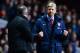 BIRMINGHAM, ENGLAND - JANUARY 13: Arsene Wenger manager of Arsenal reacts at the final whistle as he turns to Manager Paul Lambert of Aston Villa during the Barclays Premier League match between Aston Villa and Arsenal at Villa Park on January 13, 2014 i